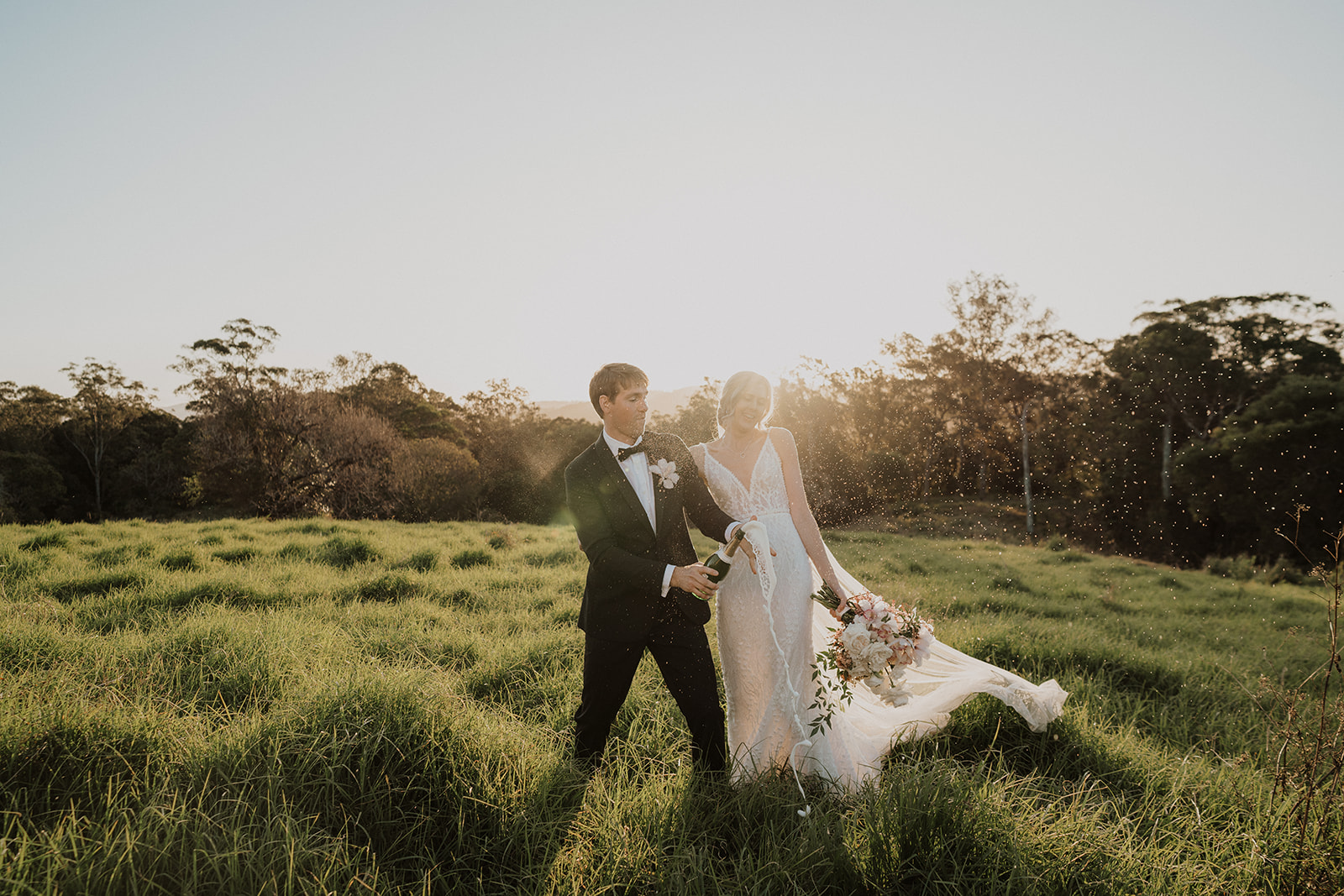 Popping champagne celebrating love at Goodwater Ridge Maleny